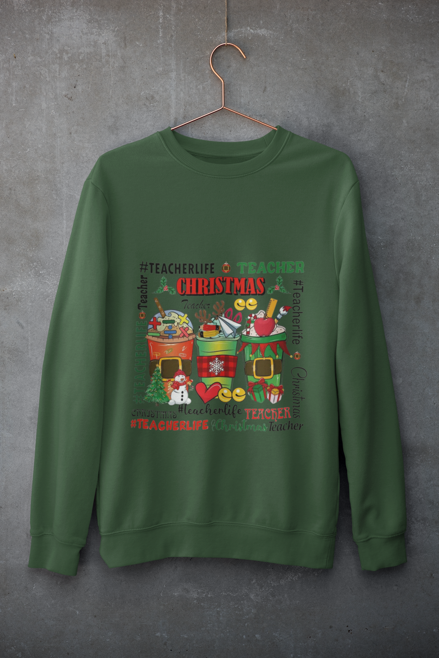 Green Forest sweatshirt with Christmas-themed design on a hanger against a gray background